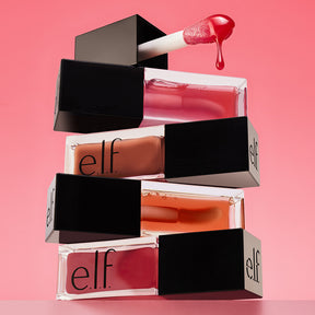 Glow Reviver Lip Oil.                       Nourishing tinted lip oil in shade Coral Fixation with a high-shine, coral finish.